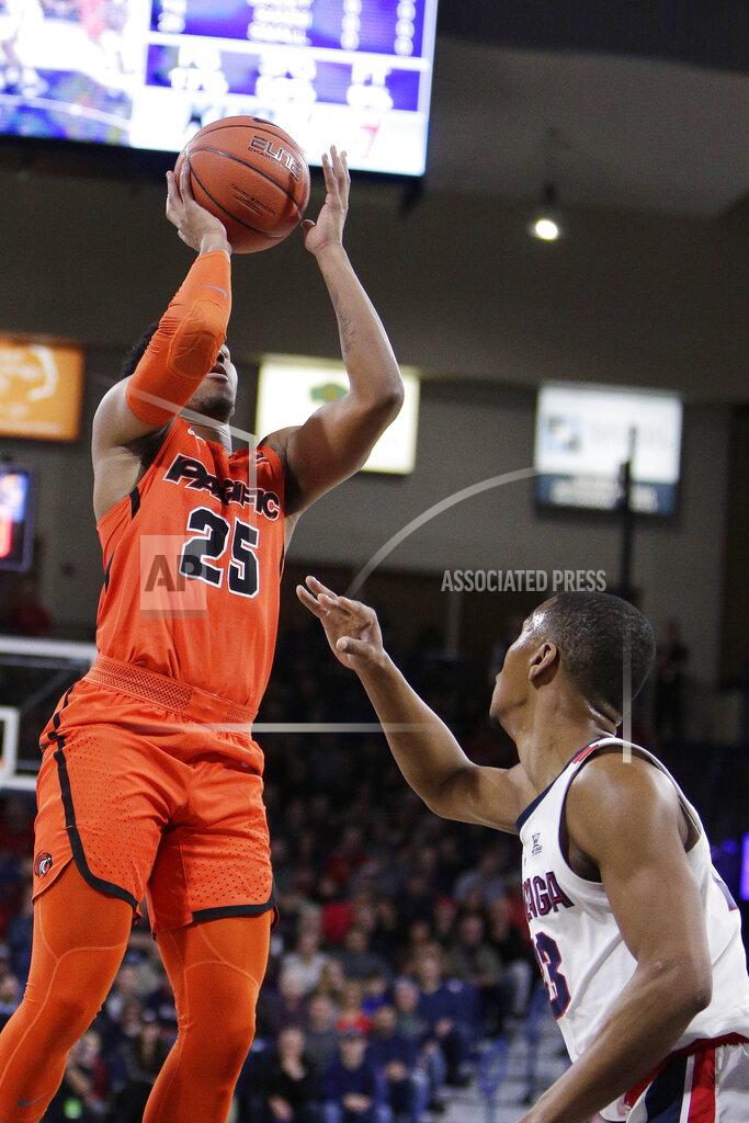 Young Kwak Pacific guard Kendall Small (25) shoots while defended by Gonzaga guard Zach Norvell Jr. during the first half of an NCAA college basketball game in Spokane, Wash., Thursday, Jan. 10, 2019. (AP Photo/Young Kwak)