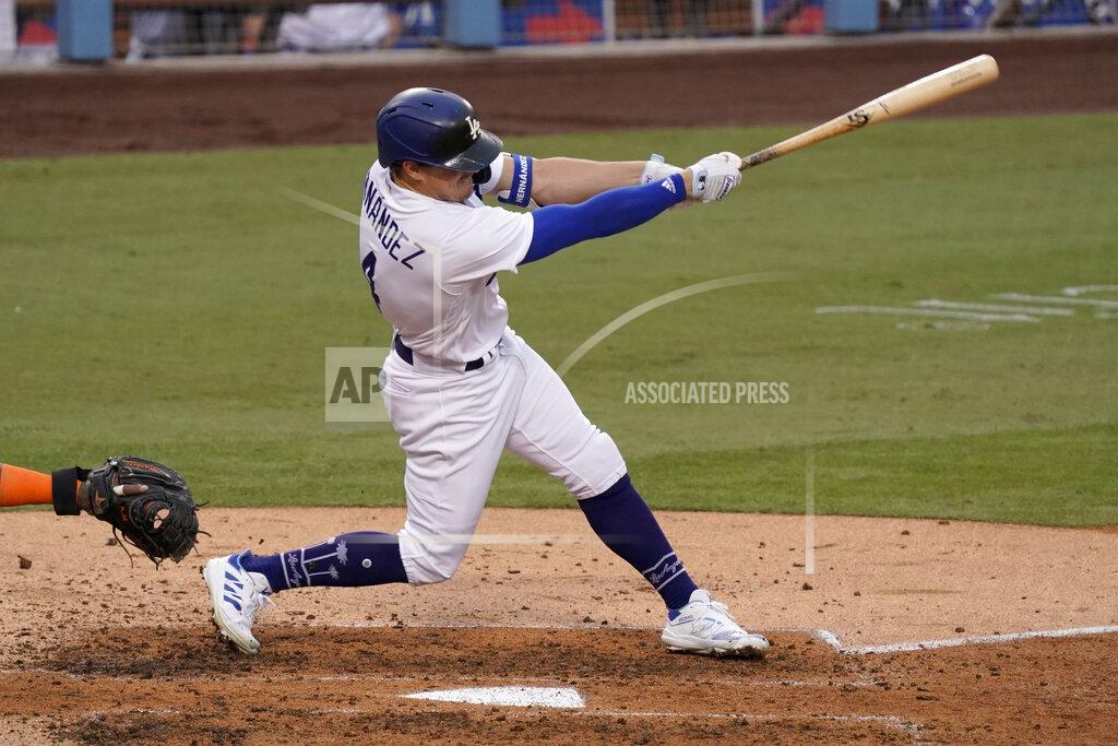 Alex Gallardo Los Angeles Dodgers' Enrique Hernandez follows through to hit a two-run scoring single during the fifth inning of a baseball game against the Houston Astros in Los Angeles, Sunday, Sept. 13, 2020. (AP Photo/Alex Gallardo)
