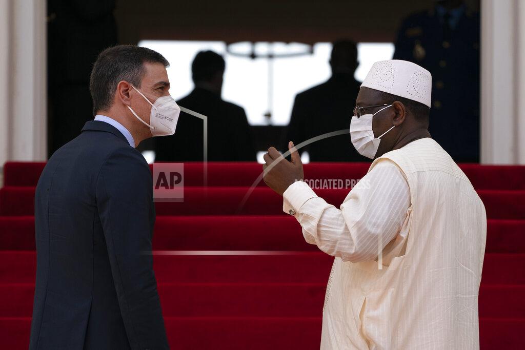 Leo Correa Senegal's President Macky Sall, right, speaks to Spanish Prime Minister Pedro Sanchez after a press conference at the presidential palace in Dakar, Senegal, Friday, April 9, 2021. Sanchez is on a mini-tour to Angola and Senegal that are key in the European country's new push to bolster ties with the neighboring continent and mitigate the migration flows that many fear could increase as a consequence of the coronavirus pandemic. (AP Photo/Leo Correa)