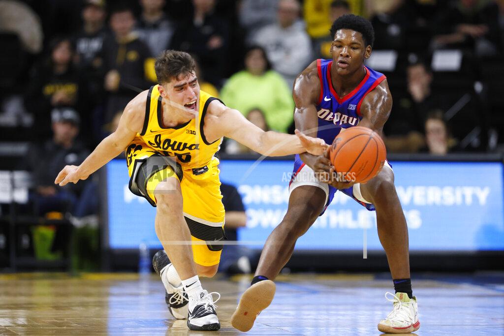 Charlie Neibergall Iowa center Luka Garza, left, tries to steal the ball from DePaul forward Romeo Weems during the second half of an NCAA college basketball game, Monday, Nov. 11, 2019, in Iowa City, Iowa. DePaul won 93-78. (AP Photo/Charlie Neibergall)