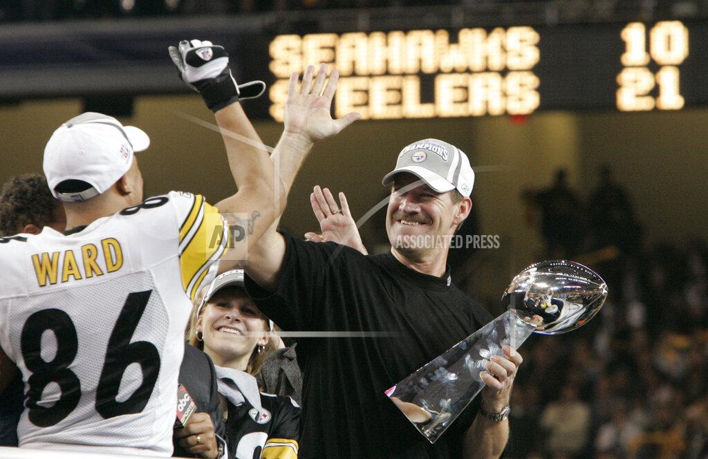 Elaine Thompson FILE - In this Sunday, Feb. 5, 2006 file photo, Pittsburgh Steelers head coach Bill Cowher high-fives Hines Ward (86), MVP of the Super Bowl XL football game, after they defeated the Seattle Seahawks, 21-10 in Detroit. Former Pittsburgh Steelers coach Bill Cowher has been elected to the Pro Football Hall of Fame. Cowher, an analyst for CBS, was surprised by the announcement made live on air in studio before the Tennessee Titans-Baltimore Ravens AFC divisional round playoff game Saturday night, Jan. 11, 2020. (AP Photo/Elaine Thompson, File)