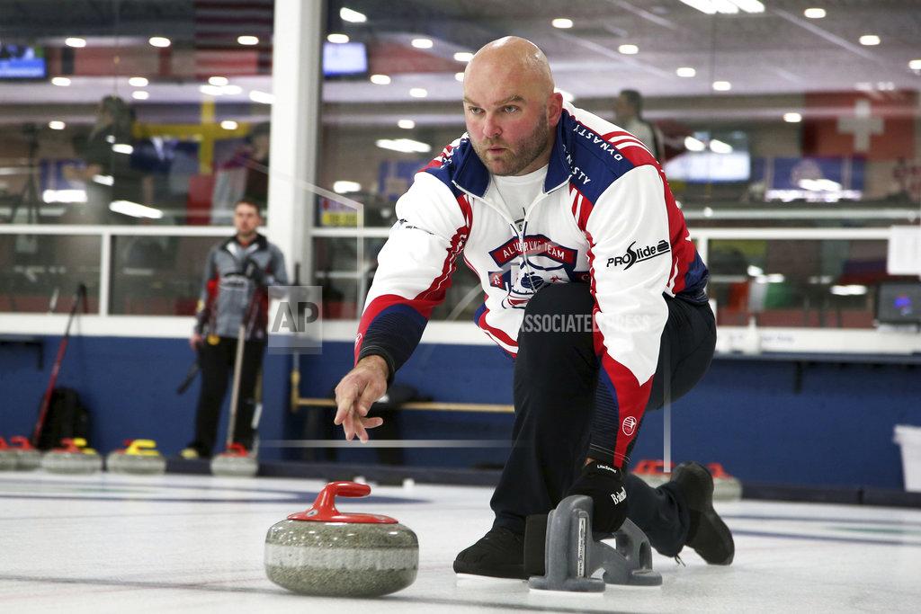 Jim Mone In this Jan. 3, 2019 photo, former NFL offensive lineman Michael Roos practices with his curling team for a competition in Blaine, Minn. Roos and three other former NFL football players who have never curled before will attempt to qualify for the U.S. championships with a goal of making it to the 2022 Olympics. (AP Photo/Jim Mone)