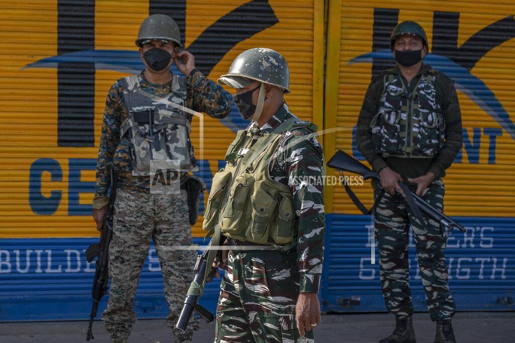 Dar Yasin Paramilitary soldiers patrol a deserted street on the first anniversary of India’s decision to revoke the disputed region’s semi-autonomy, in Srinagar, Indian controlled Kashmir, Wednesday, Aug. 5, 2020. Last year on Aug. 5, India’s Hindu-nationalist-led government of Prime Minister Narendra Modi stripped Jammu-Kashmir of its statehood and divided it into two federally governed territories. Late Tuesday, authorities lifted a curfew in Srinagar but said restrictions on public movement, transport and commercial activities would continue because of the coronavirus pandemic. (AP Photo/ Dar Yasin)
