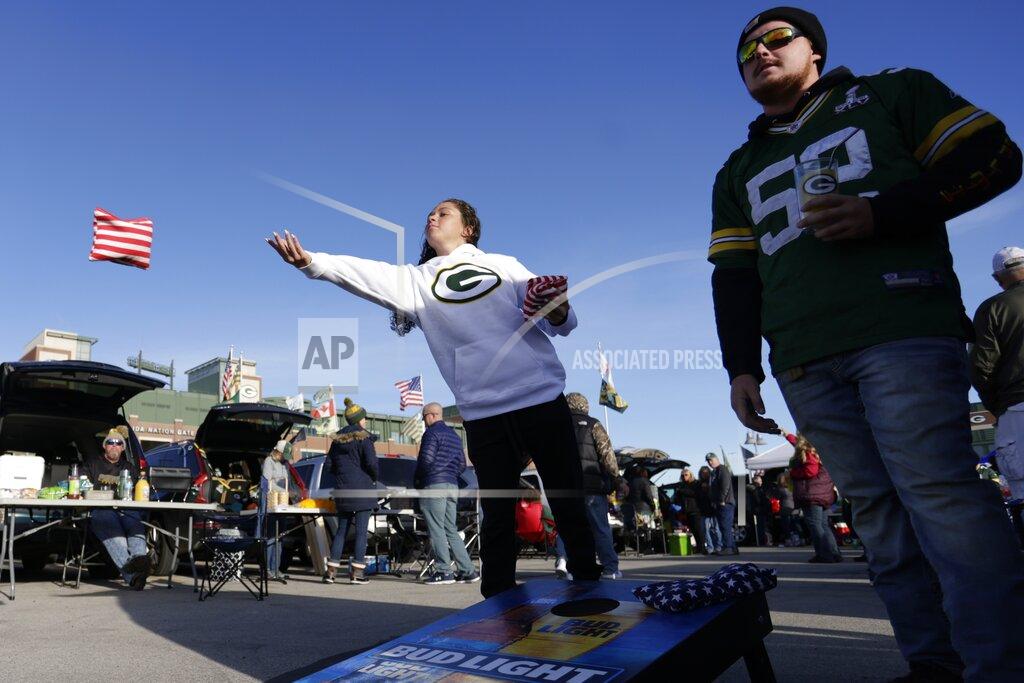 Matt Ludtke Fans outside Lambeau Field before an NFL football game between the Green Bay Packers and the Washington Football Team Sunday, Oct. 24, 2021, in Green Bay, Wis. (AP Photo/Matt Ludtke)