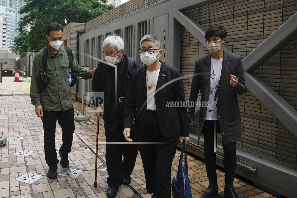 Kin Cheung From left, Hong Kong scholar Hui Po-keung, Catholic Cardinal Joseph Zen, barrister Margaret Ng and singer Denise Ho arrive for an appearance at a court in Hong Kong as they were charged in relation to their past fundraising for activists, Tuesday, May 24, 2022. (AP Photo/Kin Cheung)