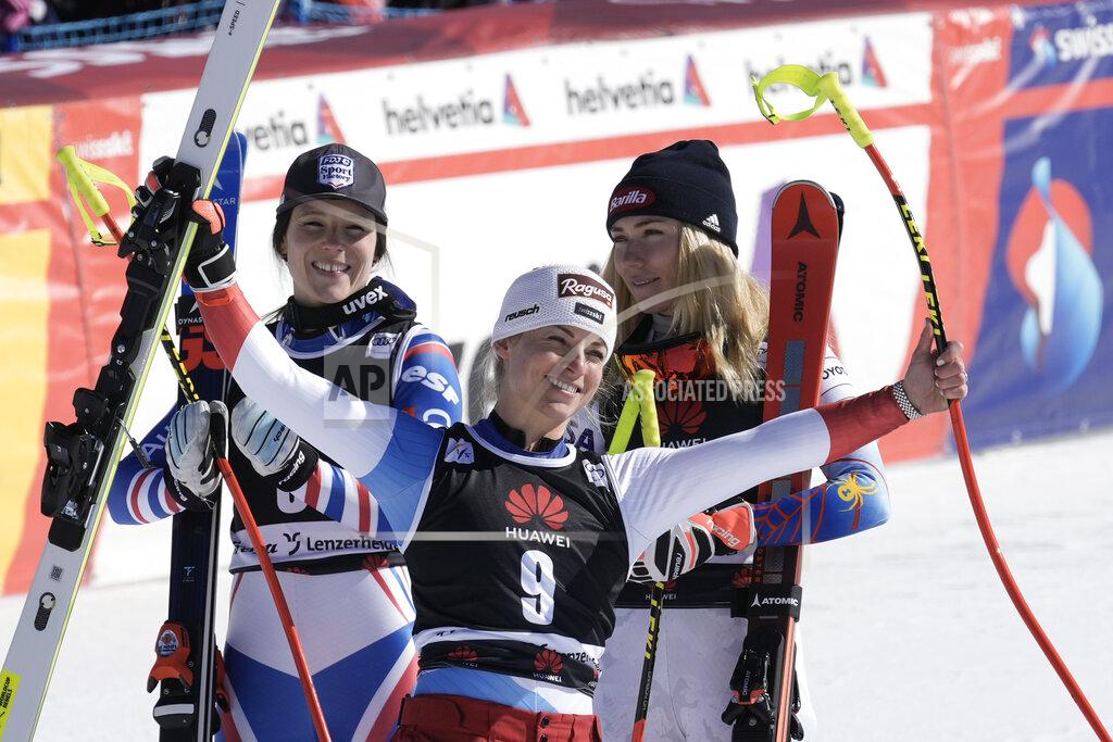 Giovanni Auletta From left, winner France's Romane Miradoli, third placed Switzerland's Lara Gut Behrami and second placed United States' Mikaela Shiffrin celebrate in the finish area of an alpine ski, women's World Cup super-G, in Lenzerheide, Switzerland, Saturday, March 5, 2022. (AP Photo/Giovanni Auletta)