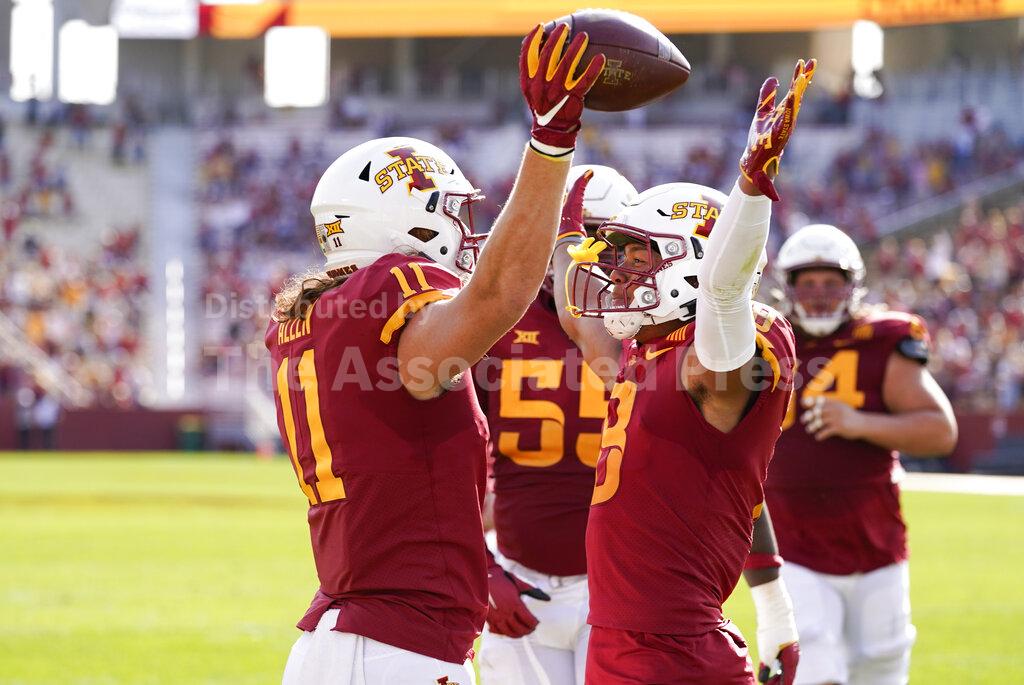 Iowa State tight end Chase Allen (11) celebrates with teammate Xavier Hutchinson after catching a 2-yard touchdown pass during the first half of an NCAA college football game against Texas Tech, Saturday, Oct. 10, 2020, in Ames, Iowa. (AP Photo/Charlie Neibergall)