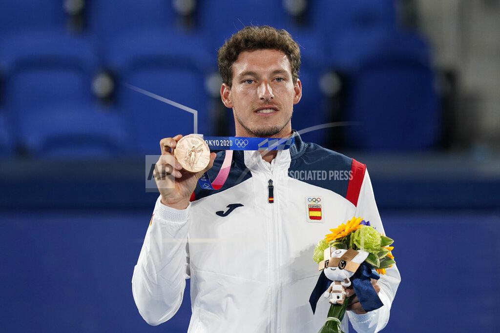 Pablo Carreno Busta, of Spain, poses with the bronze medal in the men's single of the tennis competition at the 2020 Summer Olympics, Sunday, Aug. 1, 2021, in Tokyo, Japan. (AP Photo/Patrick Semansky)