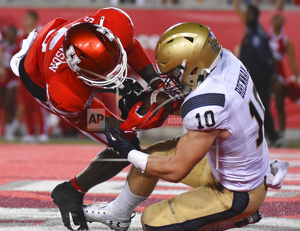 Eric Christian Smith Navy safety Kevin Brennan (10) intercepts a pass in the end zone intended for Houston wide receiver Marquez Stevenson during the second half of an NCAA college football game, Saturday, Nov. 30, 2019, in Houston. (AP Photo/Eric Christian Smith)