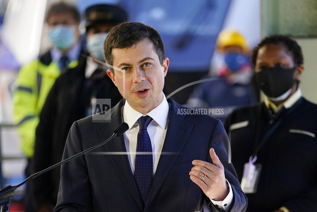 Carolyn Kaster FILE - In this Friday, Feb. 5, 2021 file photo, Transportation Secretary Pete Buttigieg speaks at Union Station in Washington. Airline officials are talking to the Biden administration about support for incentives to use cleaner fuels for airplanes. Leaders of several of the largest U.S. passenger and cargo airlines held an online meeting Friday, Feb. 26, 2021 with White House climate adviser Gina McCarthy and Transportation Secretary Pete Buttigieg.(AP Photo/Carolyn Kaster, File)
