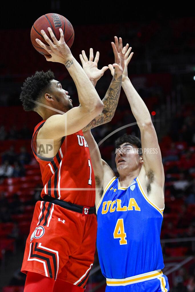 Alex Goodlett Utah forward Timmy Allen (1) shoots over UCLA guard Jaime Jaquez Jr. during the second half of an NCAA college basketball game Thursday, Feb. 20, 2020, in Salt Lake City. (AP Photo/Alex Goodlett)