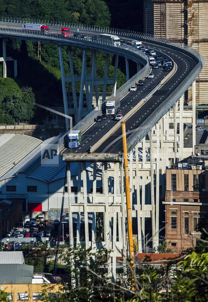 Nicola Marfisi FILE - A general view of the collapsed Morandi highway bridge in Genoa, northern Italy, Wednesday, Aug. 15, 2018. Fifty-nine people went on trial Thursday, July 7, 2022, for the 2018 collapse of Genoa’s Morandi bridge, accused of manslaughter and other charges in the deaths of 43 people.The defendants include former executives and experts of the company that manages many of Italy’s bridges and highways, as well as former officials of the transport and infrastructure ministry. (AP Photo/Nicola Marfisi)