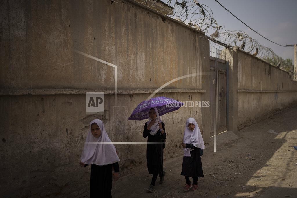 Felipe Dana Girls walk to their school before class in Kabul, Afghanistan, Sunday, Sept. 12, 2021. (AP Photo/Felipe Dana)