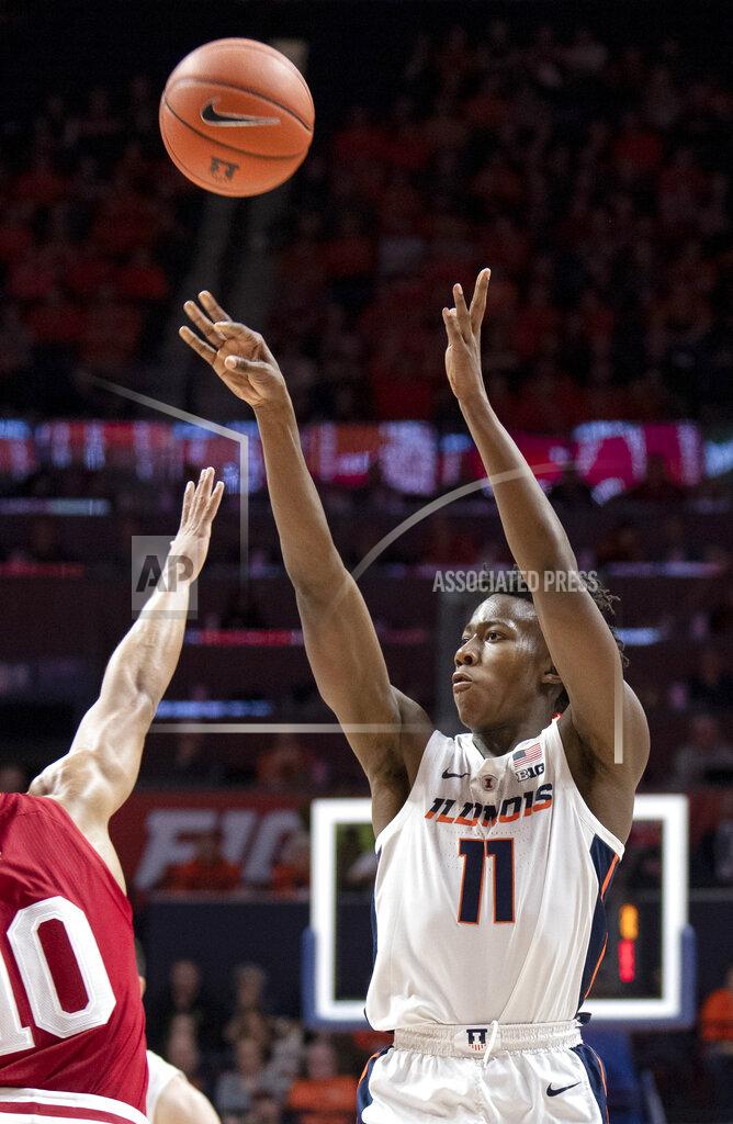 Stephen Haas Illinois guard Ayo Dosunmu (11) shoots over Indiana guard Rob Phinisee (10) during the first half of an NCAA college basketball game in Champaign, Ill., Thursday, March 7, 2019. (AP Photo/Stephen Haas)