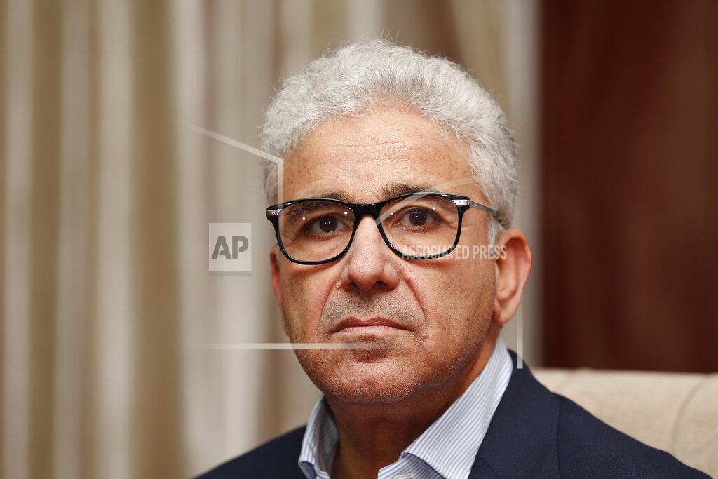Yousef Murad Fathi Bashagha, one of Libya’s rival prime ministers, gives an interview to The Associated Press, in Sirte, Libya, Wednesday, May 25, 2022. In the interview Bashagha said that he has no immediate plans to return to the capital Tripoli and attempt to rule the country from there, after an attempt last week sparked clashes. His government will work from its headquarters in the city of Sirte — on Libya’s Mediterranean coast half-way between the country’s east and west. Rival administrations from each end of Libya claim to be its legitimate rulers until elections are held. (AP Photo/Yousef Murad)