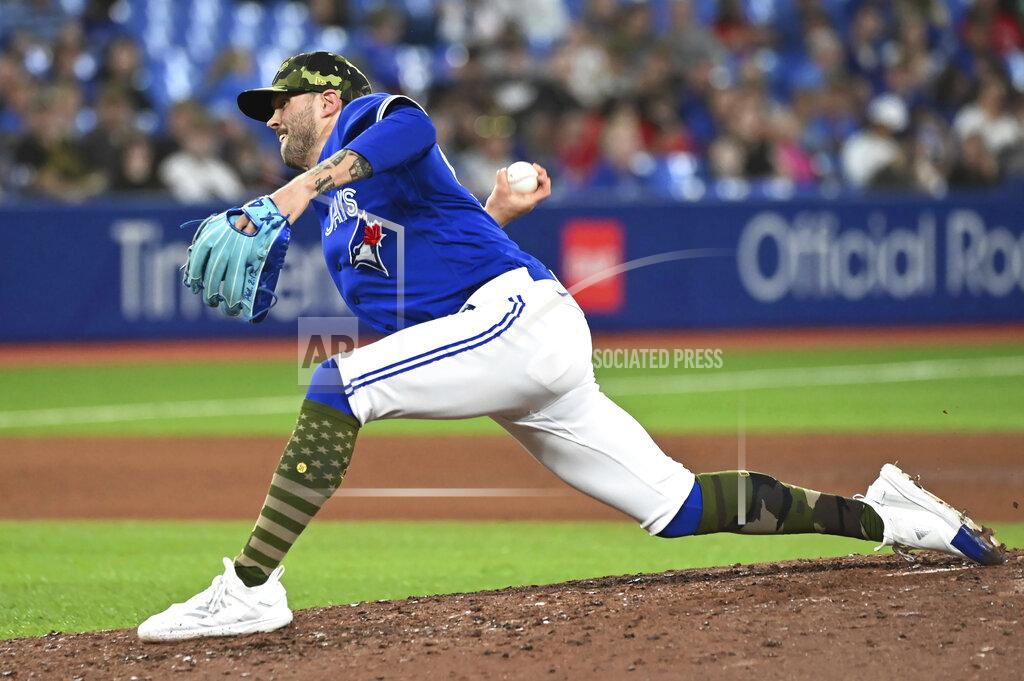 Jon Blacker Toronto Blue Jays' Adam Cimber pitches against the Cincinnati Reds during the seventh inning of a baseball game Friday, May 20, 2022, in Toronto. (Jon Blacker/The Canadian Press via AP)