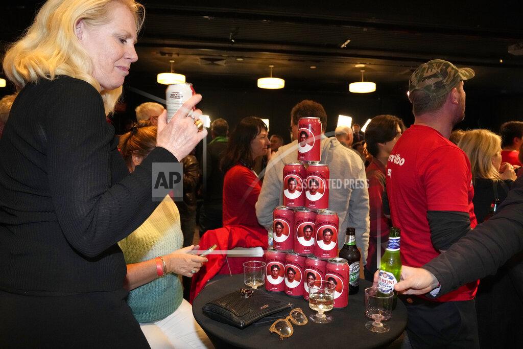 Rick Rycroft Albo branded beer cans are stacked on a table at a Labor Party event following the close of the polling places in Sydney, Australia, Saturday, May 21, 2022. Also is the nickname of Labor Party Leader Anthony Albanese. Australians voted following a six-week election campaign that has focused on pandemic-fueled inflation, climate change and fears of a Chinese military outpost being established less than 1,200 miles off Australia's shore. (AP Photo/Rick Rycroft)