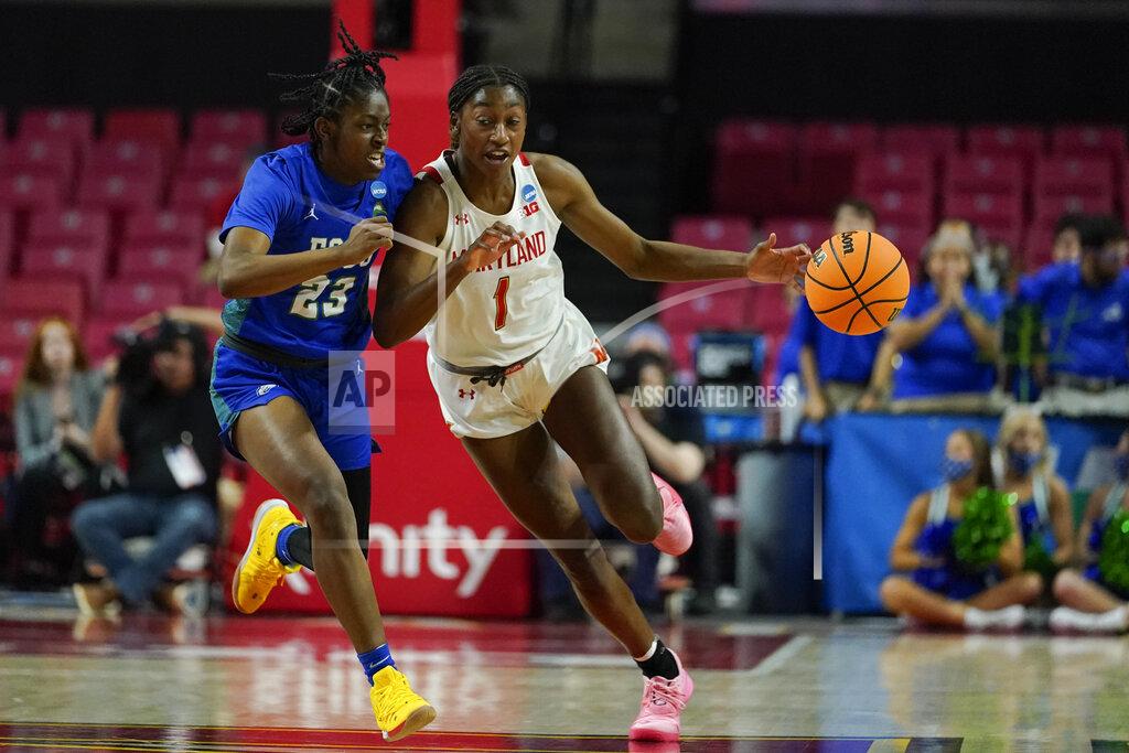 Julio Cortez Maryland guard Diamond Miller (1) drives against Florida Gulf Coast guard Karli Seay (23) during the second half of a college basketball game in the second round of the NCAA tournament, Sunday, March 20, 2022, in College Park, Md. Maryland won 89-65. (AP Photo/Julio Cortez)