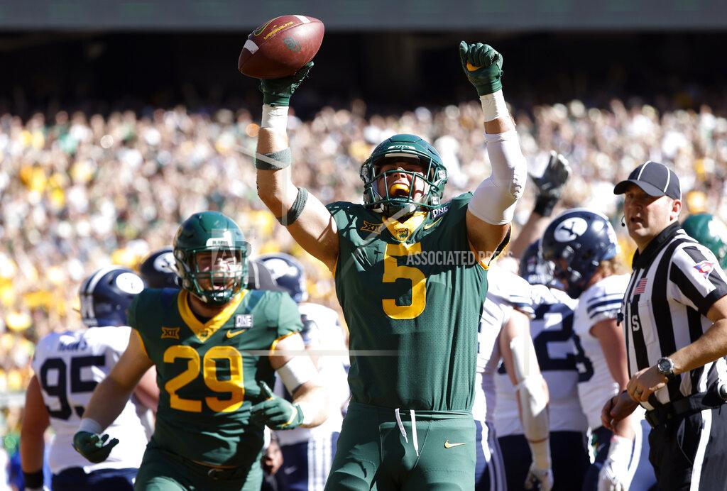 Ron Jenkins Baylor's Dillon Doyle (5) celebrates along with teammate and tight end Jackson Shupp (29) after scoring a touchdown against BYU during the first half of an NCAA college football game, Saturday, Oct. 16, 2021, in Waco, Texas. (AP Photo/Ron Jenkins)