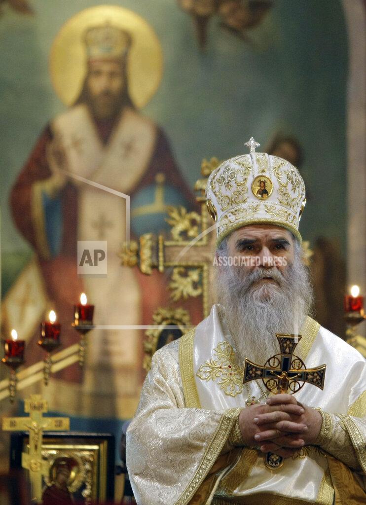 Darko Vojinovic FILE - In this Jan. 22, 2010 file photo, Bishop Amfilohije performs the liturgy in Belgrade's Congregational church, Serbia. Amfilohije, the head of the Serbian Orthodox Church in Montenegro, which led months of protests against the small Balkan state's pro-Western government, has died in hospital after contracting the coronavirus, the church said Friday, Oct. 30, 2020. (AP Photo/Darko Vojinovic, File)