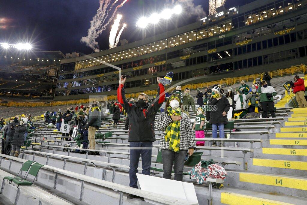 Mike Roemer A limited number of fans watch during the national anthem before an NFL football game between the Green Bay Packers and the Chicago Bears Sunday, Nov. 29, 2020, in Green Bay, Wis. (AP Photo/Mike Roemer)