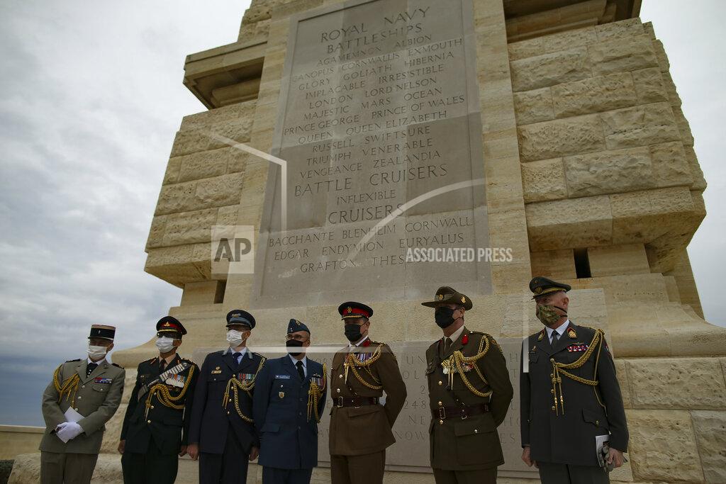 Emrah Gurel military personnel pose for pictures following a ceremony to commemorate soldiers who died during the World War I campaign on the Gallipoli peninsula, in Canakkale, Turkey, Saturday, April 24, 2021, a day ahead of the 106th anniversary of the Gallipoli Campaign.The Gallipoli Campaign of 1915 by Allied forces aimed to take control of the peninsula to weaken the Ottoman Empire. The campaign failed and Allied forces withdrew after eight months of fighting on the ground and some 250,000 casualties on both sides. The memorials were kept small due to the COVID-19 pandemic.(AP Photo/Emrah Gurel)