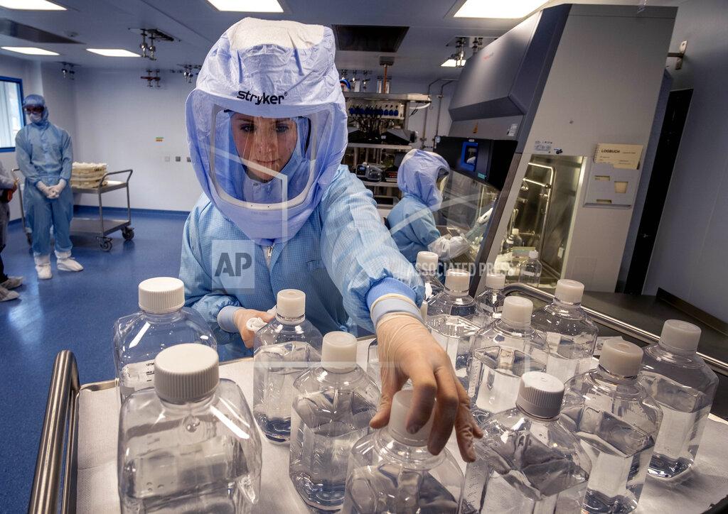 Michael Probst FILE - In this March 27, 2021 file photo a laboratory worker simulates the workflow in a cleanroom of the BioNTech Corona vaccine production in Marburg, Germany, during a media day. Countries in the European Union have ramped up the vaccination after sluggish start. The uptick comes as countries across Europe also grapple with a rise in infections that has pushed the EU’s overall number of confirmed cases close to 30 million. (AP Photo/Michael Probst, file)