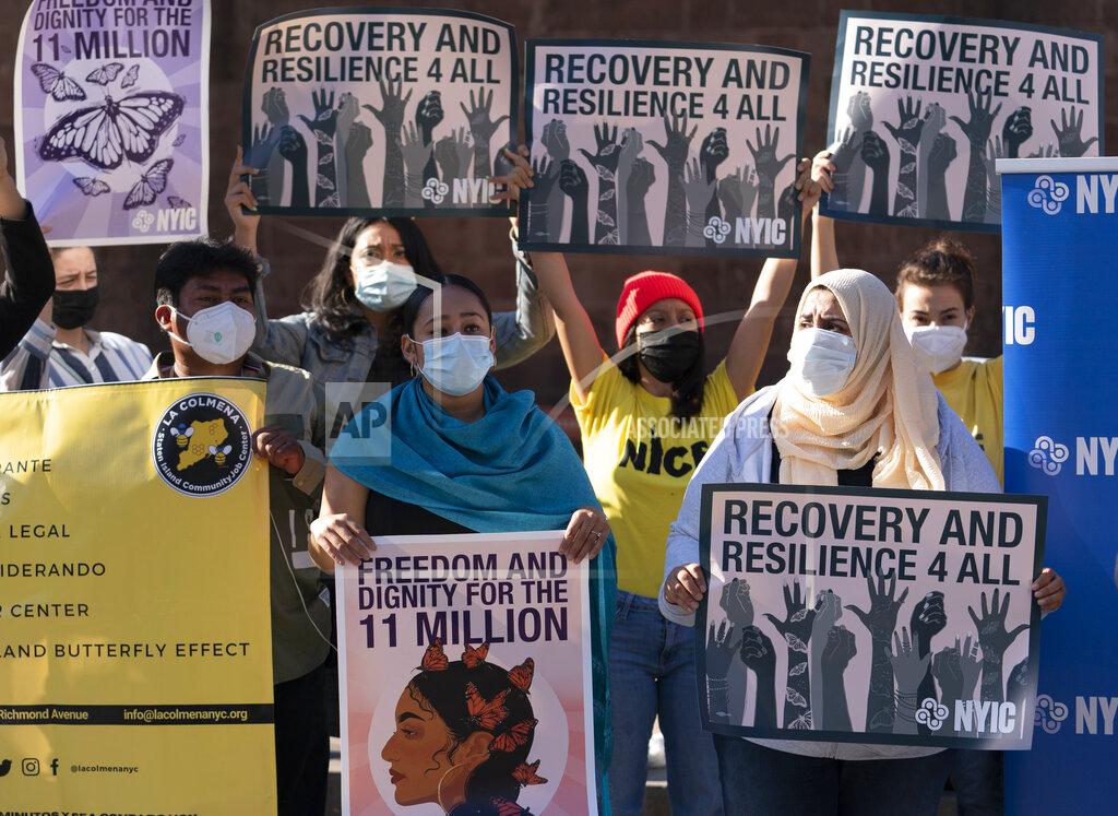 Mark Lennihan FILE - In this Nov. 9, 2020, file photo, demonstrators with the New York Immigration Coalition rally asking President-elect Joe Biden to prioritize immigration reform in New York. Immigrant rights activists energized by a new Democratic administration and majorities on Capitol Hill are gearing up for a fresh political battle to push through a proposed bill from Biden that would open a pathway to citizenship for up to 11 million people. (AP Photo/Mark Lennihan, File)