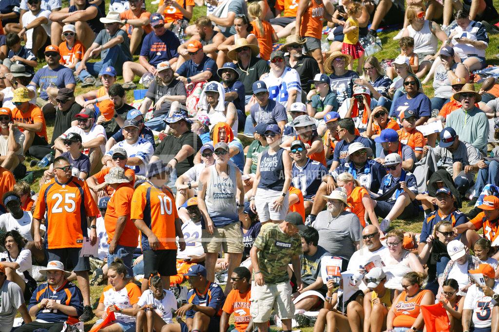 David Zalubowski Dallas Cowboys and Denver Broncos fans watch NFL football practice Thursday, Aug. 11, 2022, at the Denver Broncos' headquarters in Centennial, Colo. (AP Photo/David Zalubowski)