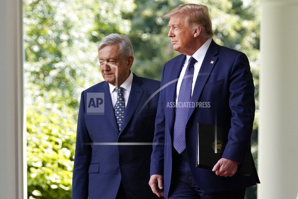 Evan Vucci President Donald Trump and Mexican President Andres Manuel Lopez Obrador arrive for an event in the Rose Garden at the White House, Wednesday, July 8, 2020, in Washington. (AP Photo/Evan Vucci)