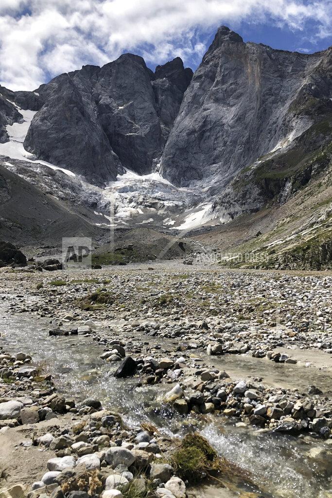 Aritz Parra A view of the Petit Vignemale glacier, left, and the Oulettes, right, on the Vignemale massif's north face in the Pyrenean mountain range, as seen from the Gaube valley in southern France, Sunday, Aug. 3, 2020. Spanish scientists say Europe's southernmost glaciers will likely be reduced to ice patches in the next two decades due to climate change. The study also found that the shrinking of ice mass on the Pyrenees mountain range is continuing at the steady but rapid speed seen at least since the 1980s. (AP Photo/Aritz Parra)