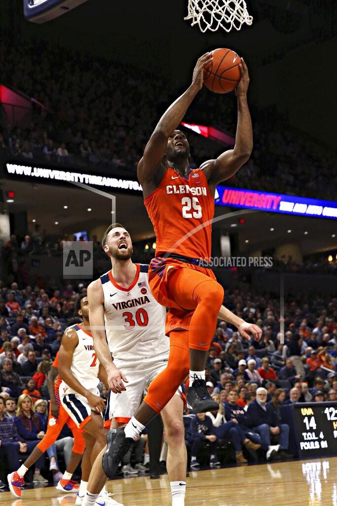 Erin Edgerton Clemson forward Aamir Simms (25) shoots in front of Virginia's Jay Huffduring an NCAA college basketball game Wednesday, Feb. 5, 2020, in Charlottesville, Va. (Erin Edgerton/The Daily Progress via AP)