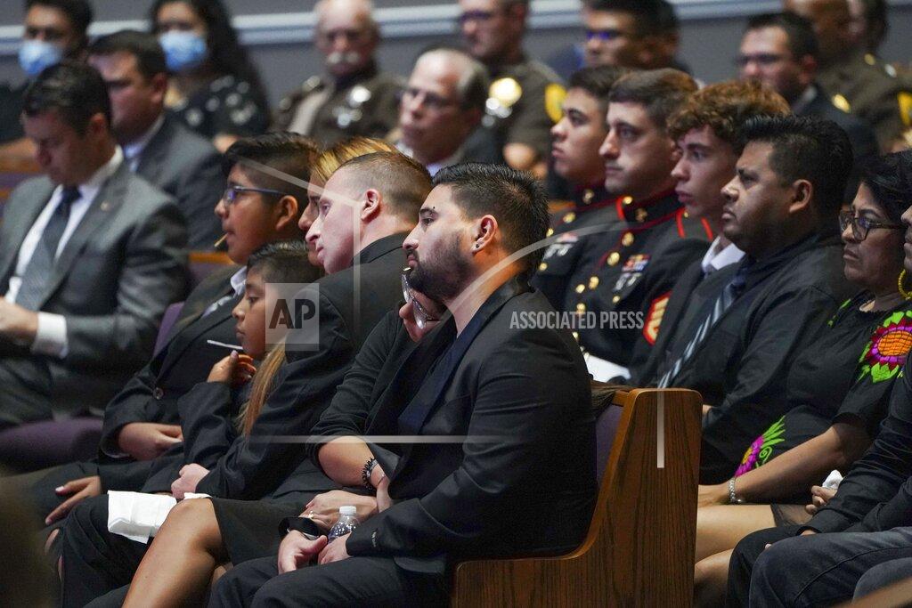 Jonah Hinebaugh The family of Marine Cpl. Humberto Sanchez waits for the funeral service to begin at LifeGate Church in Logansport, Ind., on Tuesday, Sept. 14, 2021. Sanchez was one of 13 U.S. service members killed in last month's suicide bombing at Afghanistan’s Kabul airport during the U.S.-led evacuation. (Jonah Hinebaugh/The Pharos-Tribune via AP)