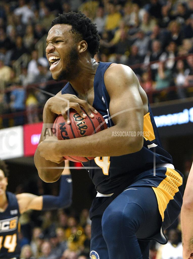 Kathy Kmonicek UNC-Greensboro forward Mohammed Abdulsalam (4) celebrates grabbing a rebound against Wofford in the first half of an NCAA college basketball game for the Southern Conference tournament championship, Monday, March 11, 2019, in Asheville, N.C. (AP Photo/Kathy Kmonicek)