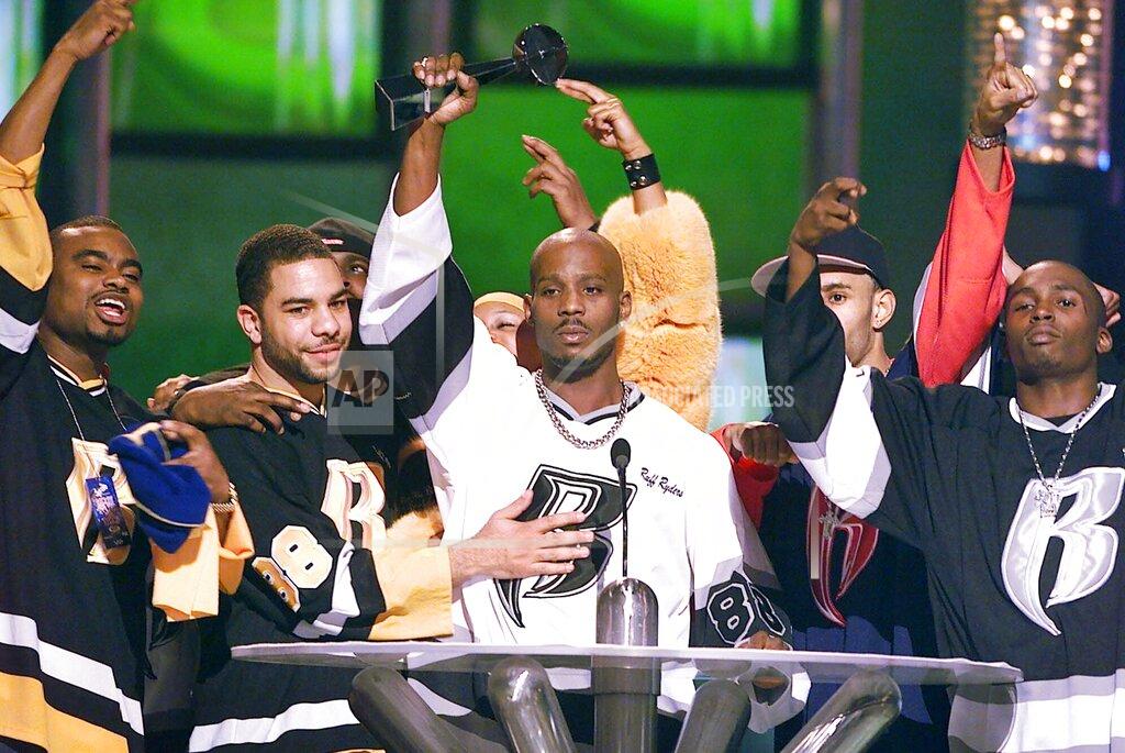 Laura Rauch FILE - DMX, center, accepts the R&B Album Artist of the Year during the 1999 Billboard Music Awards in Las Vegas, on Dec. 8, 1999. The family of rapper DMX says he has died at age 50 after a career in which he delivered iconic hip-hop songs such as “Ruff Ryders’ Anthem." A statement from the family says the Grammy-nominated rapper died at a hospital in White Plains, New York, "with his family by his side" after being placed on life support for the past few days. He was rushed to a New York hospital from his home April 2. (AP Photo/Laura Rauch, File)