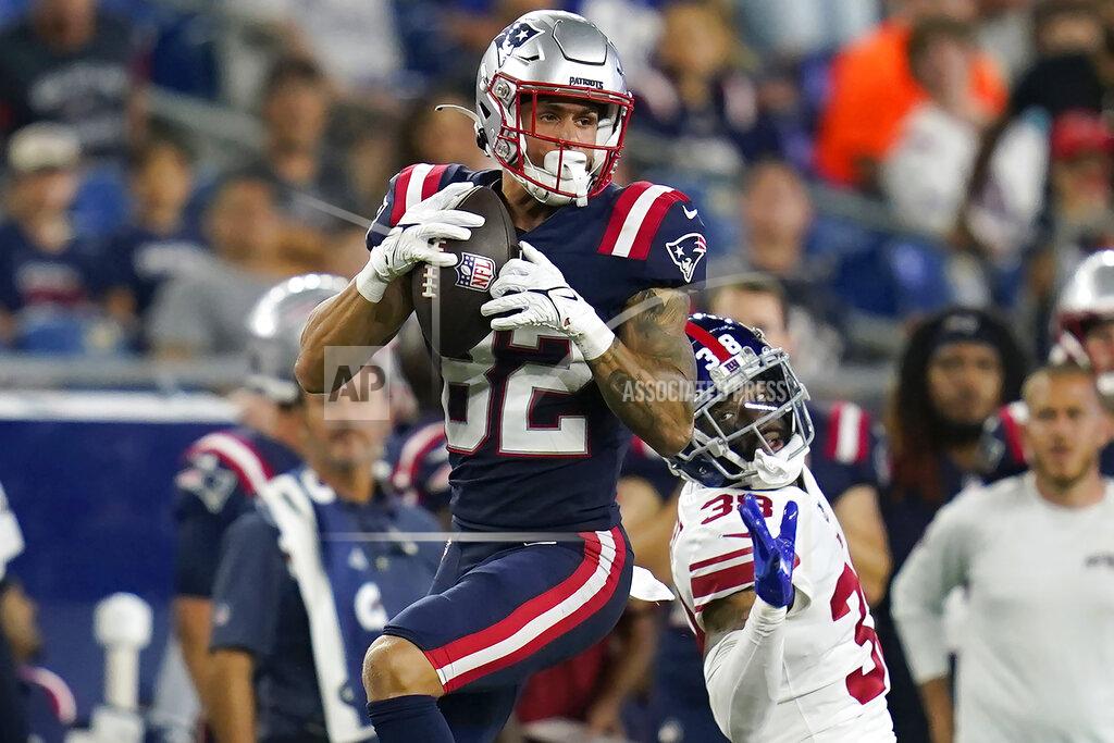 Charles Krupa New England Patriots wide receiver Tre Nixon (82) makes a catch as New York Giants cornerback Zyon Gilbert (38) defends during the second half of a preseason NFL football game Thursday, Aug. 11, 2022, in Foxborough, Mass. (AP Photo/Charles Krupa)