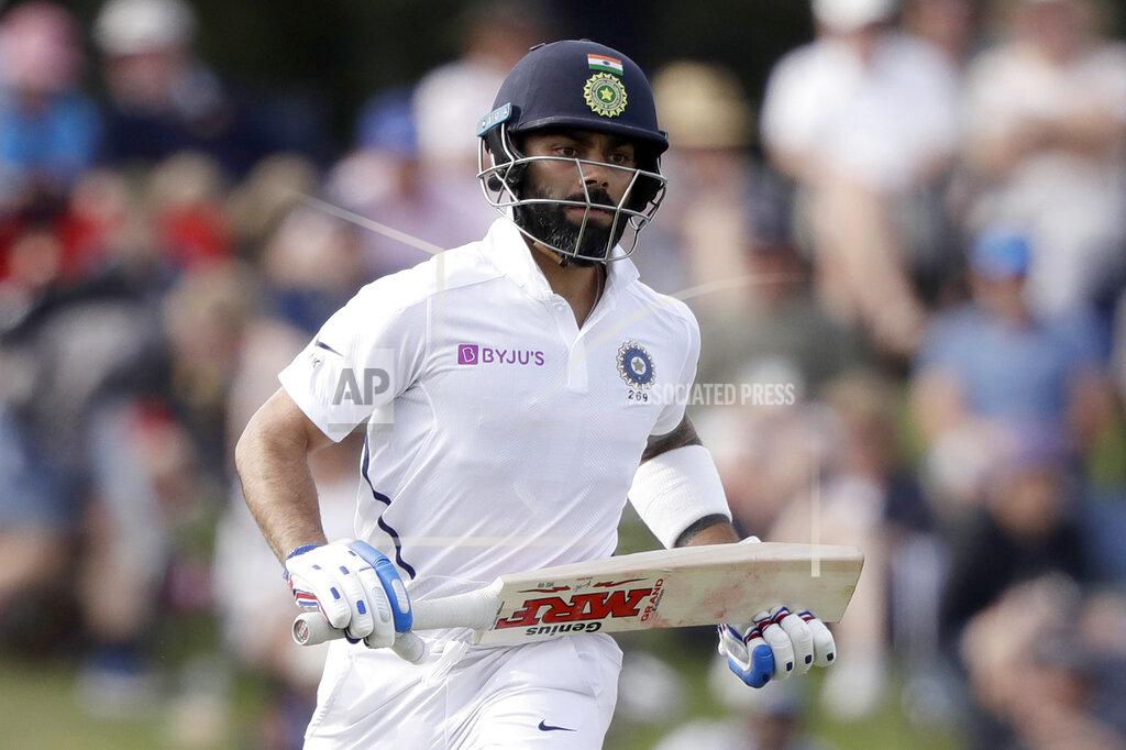 Mark Baker FILE - In this March 1, 2020, file photo, India's Virat Kohli runs a single while batting during play on day two of the second cricket test between New Zealand and India at Hagley Oval in Christchurch, New Zealand. The Indian Premier League, the lucrative Twenty20 cricket competition that has been delayed several months and is now set to be played away from home in the United Arab Emirates because of the COVID-19 pandemic. It begins this weekend with no spectators allowed to start with, and restrictions on crowds right until the end.(AP Photo/Mark Baker, File)