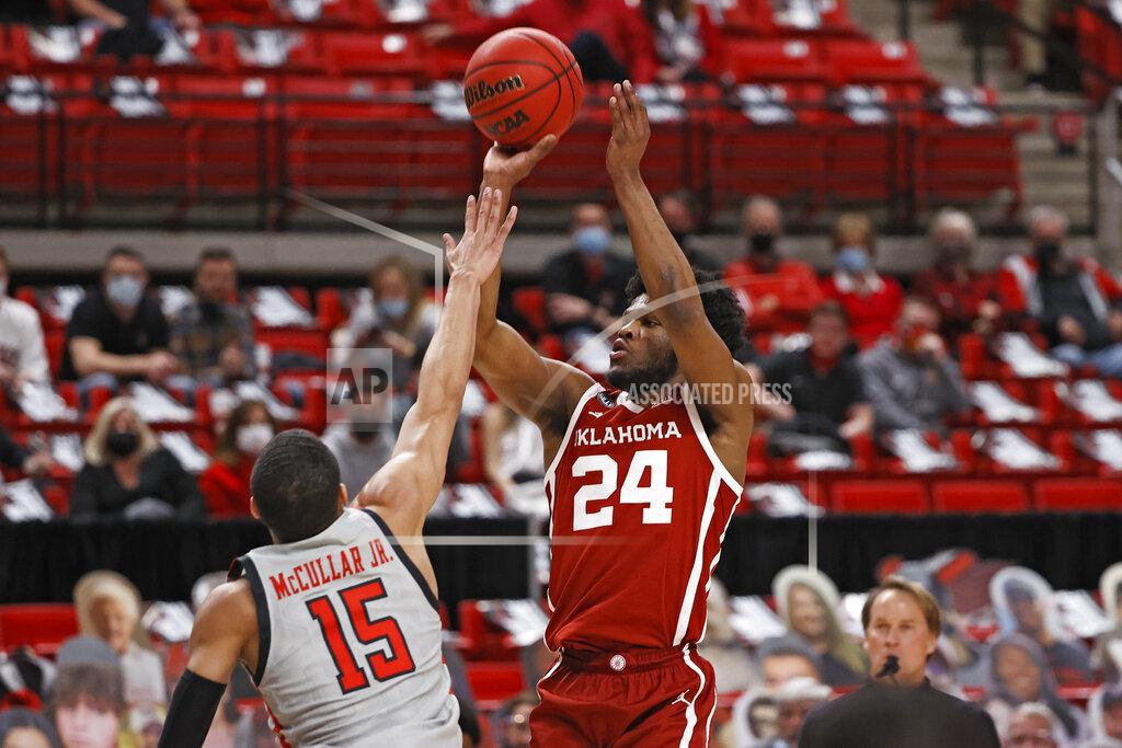 Brad Tollefson Oklahoma's Elijah Harkless (24) shoots ball over Texas Tech's Kevin McCullar (15) during the first half of an NCAA college basketball game Monday, Feb. 1, 2021, in Lubbock, Texas. (AP Photo/Brad Tollefson)