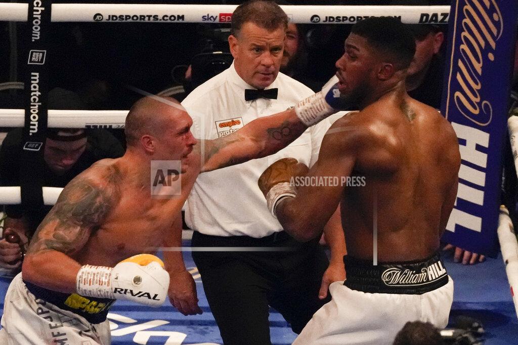 Frank Augstein Oleksandr Usyk of Ukraine, left, throws a punch at Anthony Joshua of Britain during their WBA (Super), WBO and IBF boxing title bout at the Tottenham Hotspur Stadium in London, Saturday, Sept. 25, 2021. (AP Photo/Frank Augstein)