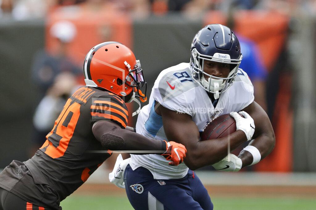 Ron Schwane Cleveland Browns cornerback Terrance Mitchell (39) tackles Tennessee Titans tight end Jonnu Smith (81) after a pass reception during the first half in an NFL football game Sunday, Sept. 8, 2019, in Cleveland. (AP Photo/Ron Schwane)