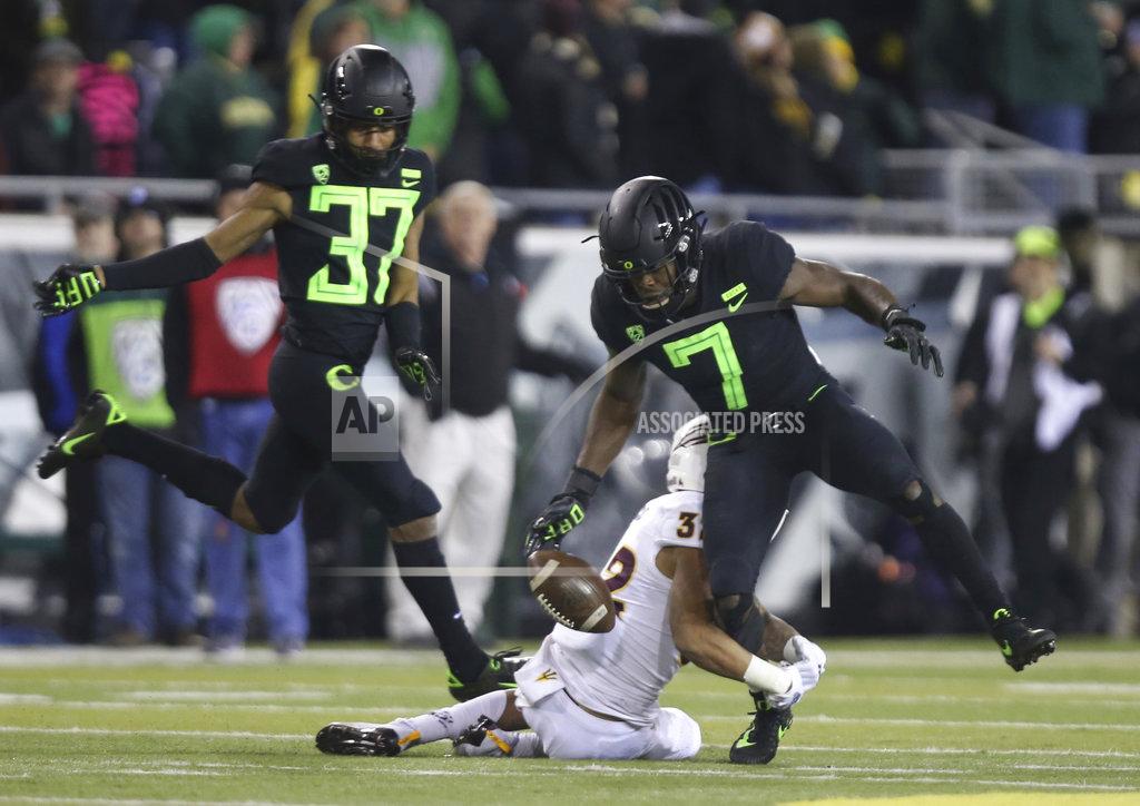 Chris Pietsch Oregon's Ugochukwu Amadi, right, loses control of a punt us he is tackled by Arizona State's Paul Lucas during the fourth quarter of an NCAA college football game Saturday, Nov. 17, 2018, in Eugene, Ore. (AP Photo/Chris Pietsch)