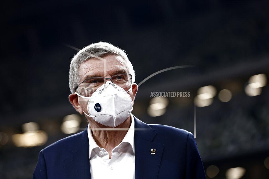 Behrouz Mehri IOC President Thomas Bach visits the National Stadium, the main venue for the 2020 Olympic and Paralympic Games postponed until July 2021 due to the coronavirus pandemic, in Tokyo Tuesday, Nov. 17, 2020. Bach said during this week's trip to Tokyo that he is “encouraging” all Olympic “participants” and fans to be vaccinated - if one becomes available - if they are going to attend next year's Tokyo Olympics. (Behrouz Mehri/Pool Photo via AP)