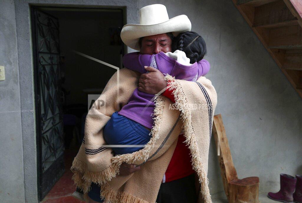 Martin Mejia Free Peru party presidential candidate Pedro Castillo hugs his daughter Alondra who cries for him not to leave home, as he prepares to campaign in Chugur, Peru, Thursday, April 15, 2021. Castillo will face rival candidate Keiko Fujimori in the June 6 presidential run-off election. (AP Photo/Martin Mejia)