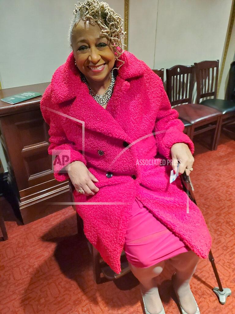 Marsha Battle Philpot In this March 7, 2020, photo provided by Marsha Battle Philpot, Brenda Perryman, sits at a Detroit Symphony Orchestra performance at the Max M. and Marjorie S. Fisher Music Center, in Detroit. As the coronavirus tightens its grip across the country, it is cutting a particularly devastating swath through an already vulnerable population, black Americans. In Detroit, the deaths include Gloria Smith, a fixture at the city’s African World Festival, who died within a week of her husband, and educator and playwright Perryman. (Marsha Battle Philpot, aka Marsha Music via AP)