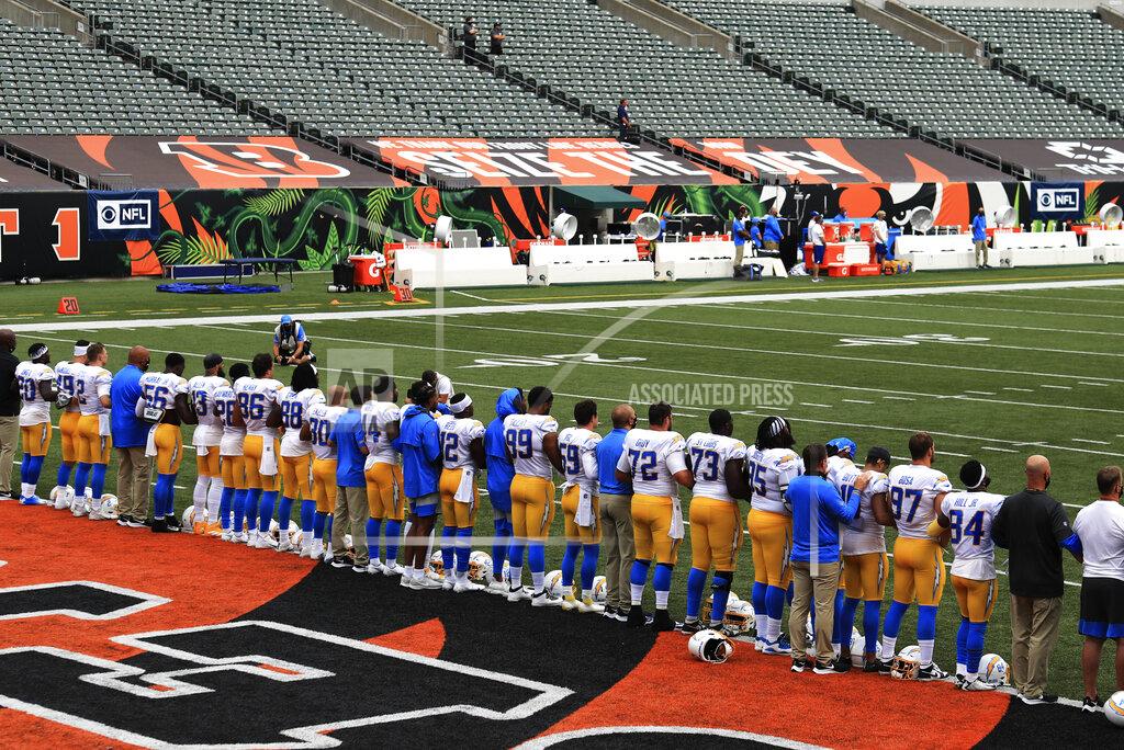 Aaron Doster The Los Angeles Chargers stand arm in arm as "Lift Every Voice and Sing" is played before an NFL football game between the Cincinnati Bengals and the Los Angeles Chargers, Sunday, Sept. 13, 2020, in Cincinnati. (AP Photo/Aaron Doster)