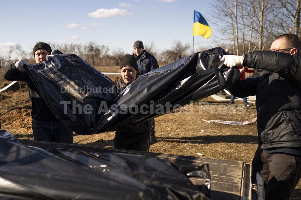 A year into Ukraine war, bodies dug up in once occupied... - Vimarsana News