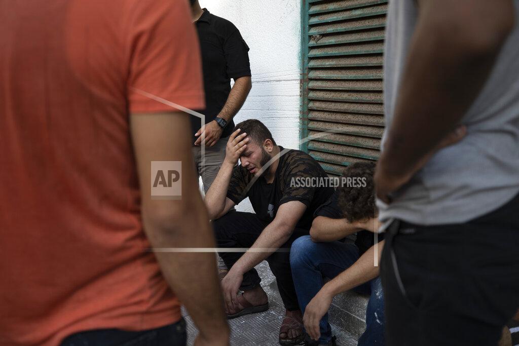 Fatima Shbair Relatives react while waiting at the hospital to see the body of Islamic Jihad said Taiseer al-Jabari who was killed during Israeli airstrikes on his apartment in Gaza City, Friday, Aug. 5, 2022. Palestinian officials say Israeli airstrikes on Gaza have killed several people, including a senior militant, and wounded 40 others. (AP Photo/Fatima Shbair)
