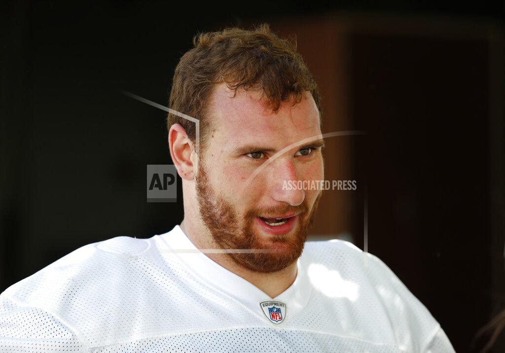 FILE - Detroit Lions offensive lineman Frank Ragnow talks after an NFL football practice in Allen Park, Mich., in this Monday, June 11, 2018, file photo.The Detroit Lions have signed Pro Bowl center Frank Ragnow to a $54 million, four-year extension that keeps him under contract through the 2026 season. The team announced the deal Friday, May 7, 2021, investing in one of the franchise’s building blocks under general manager Brad Holmes and coach Dan Campbell. (AP Photo/Paul Sancya, File)