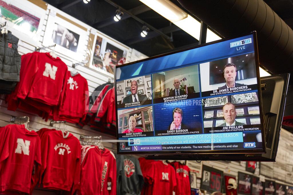 Nati Harnik The Husker Hounds sports apparel store in Omaha, Neb., shows on television screens Wednesday, Sept. 16, 2020, a Big Ten virtual news conference to discuss the reopening of the football season. Less than five weeks after pushing football and other fall sports to spring in the name of player safety during the pandemic, the conference changed course Wednesday and said it plans to begin its season the Oct. 23-24 weekend. Each team will have an eight-game schedule. (AP Photo/Nati Harnik)