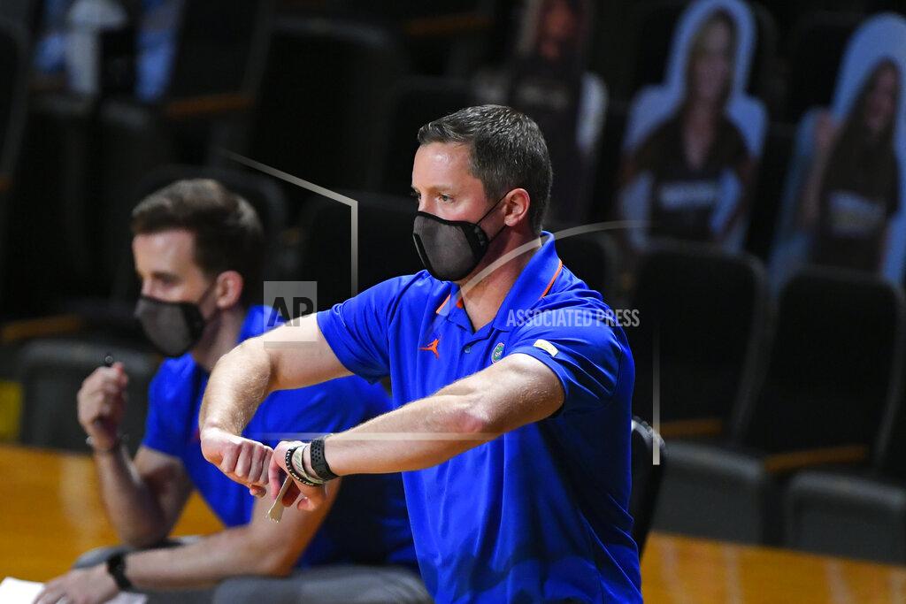 John Amis Florida coach Mike White motions to players during the first half of the team's NCAA college basketball game against Vanderbilt, Wednesday, Dec. 30, 2020, in Nashville, Tenn. (AP Photo/John Amis)